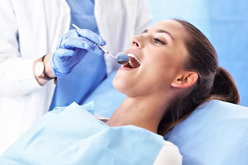 close up of woman receiving dental exam