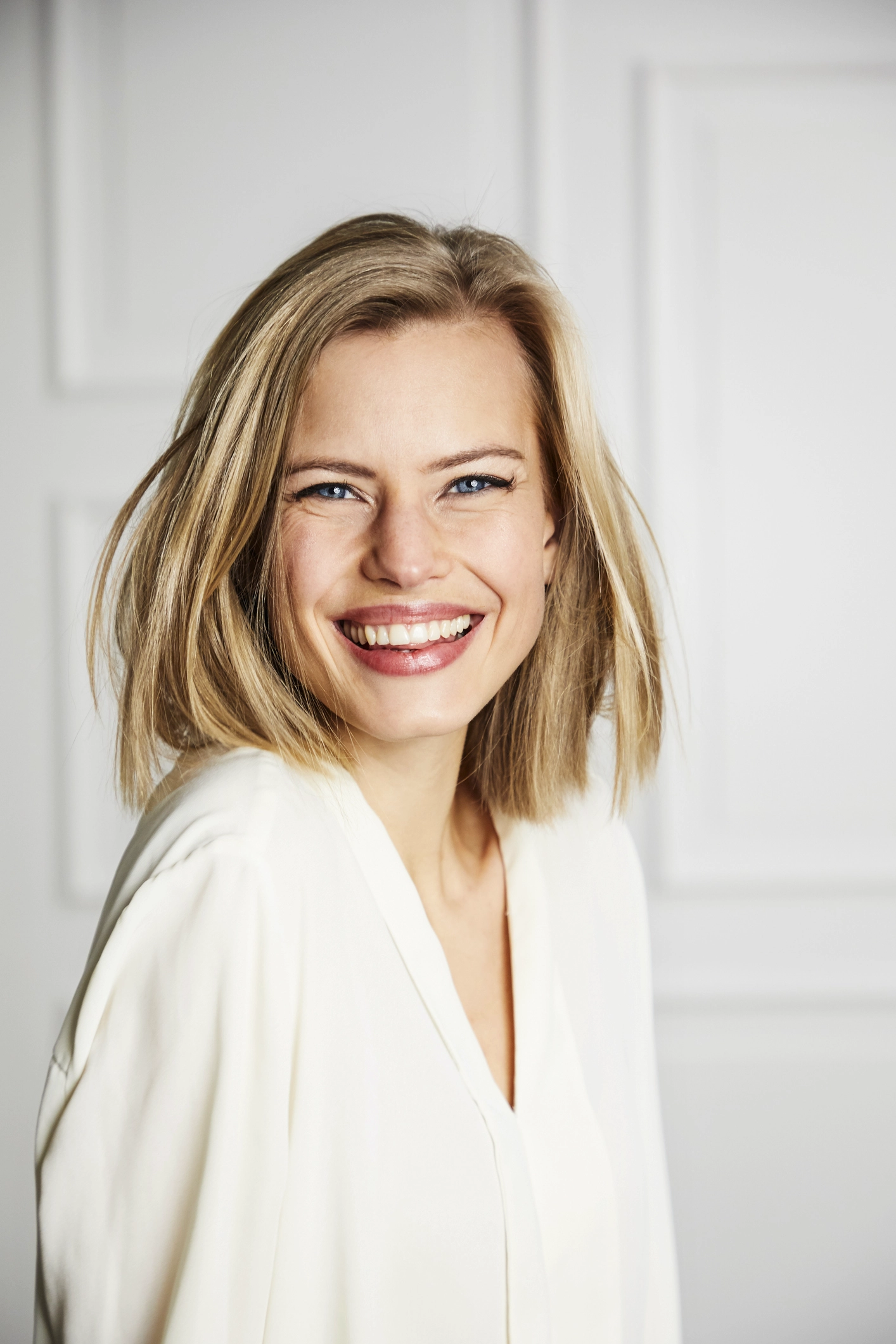 close up of young blonde woman with pretty smile