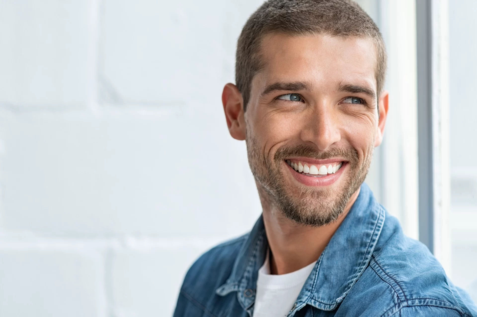 close up portrait of man with a pretty white smile