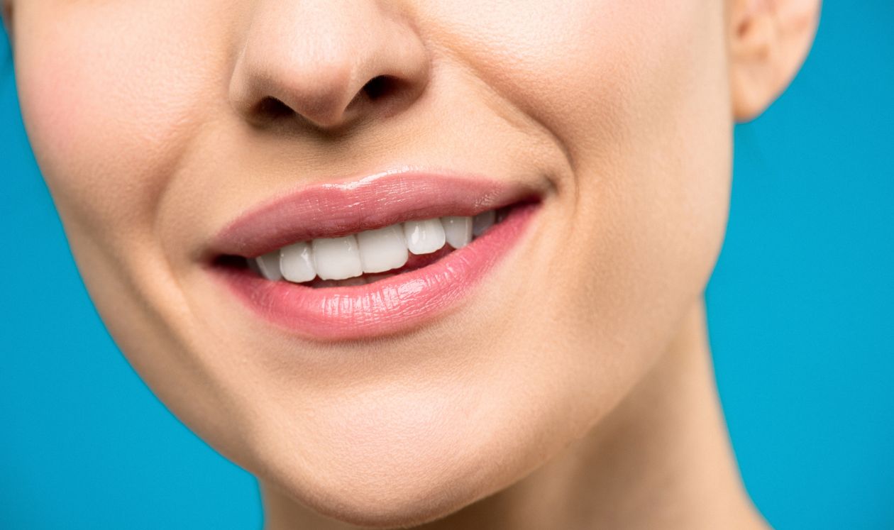 Woman with beautiful white smile for summer dental care tips