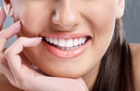 close up of woman's mouth with really white teeth