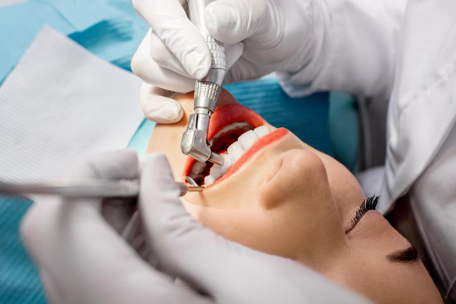 woman receiving tooth extraction procedure