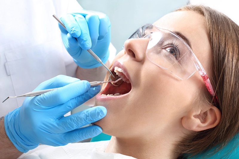 young woman receiving dental checkup